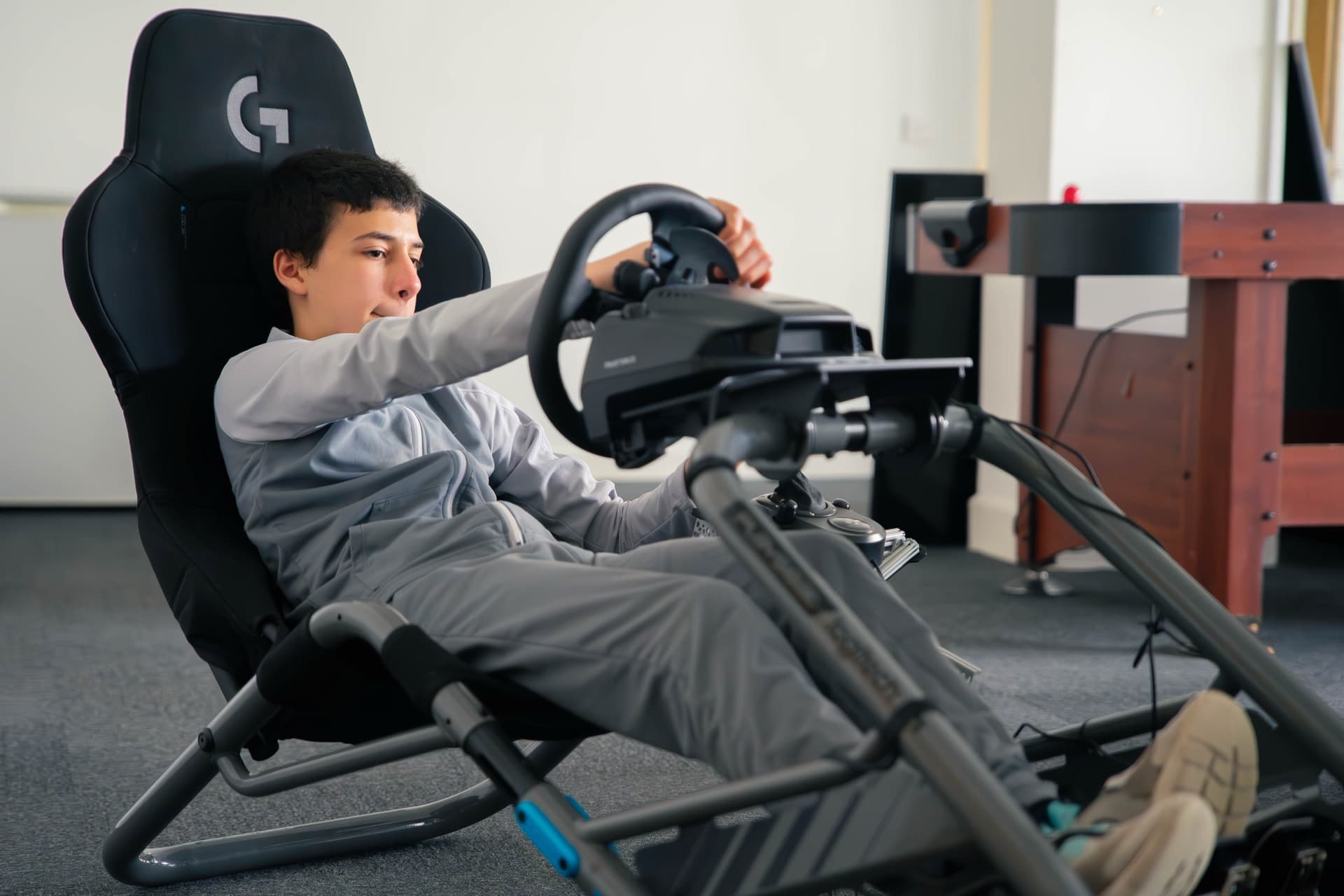 Student at a racing simulator station at Robocode centre